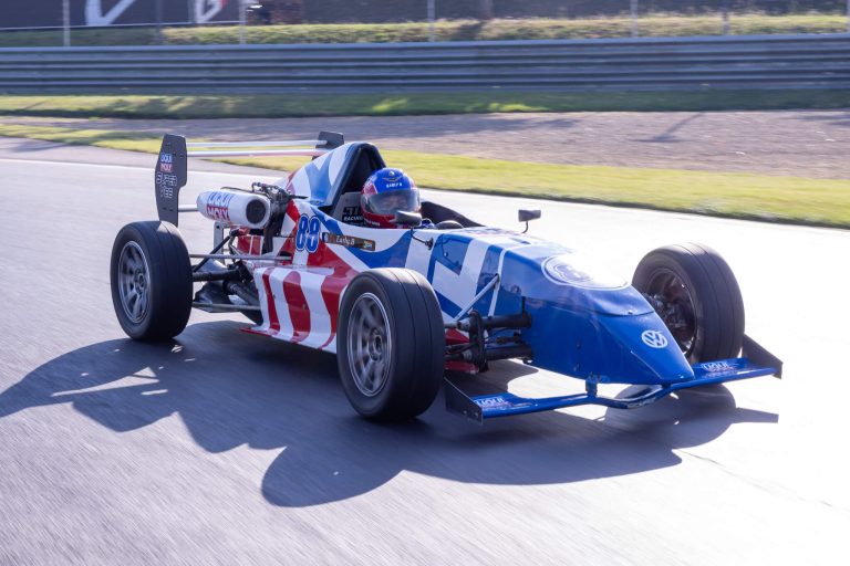 Single-seater race car on track, photographed by Indirect Media
