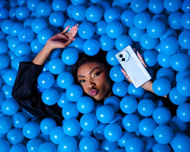 Model with a vivo smartphone in a blue ball pit, photographed by Indirect Media