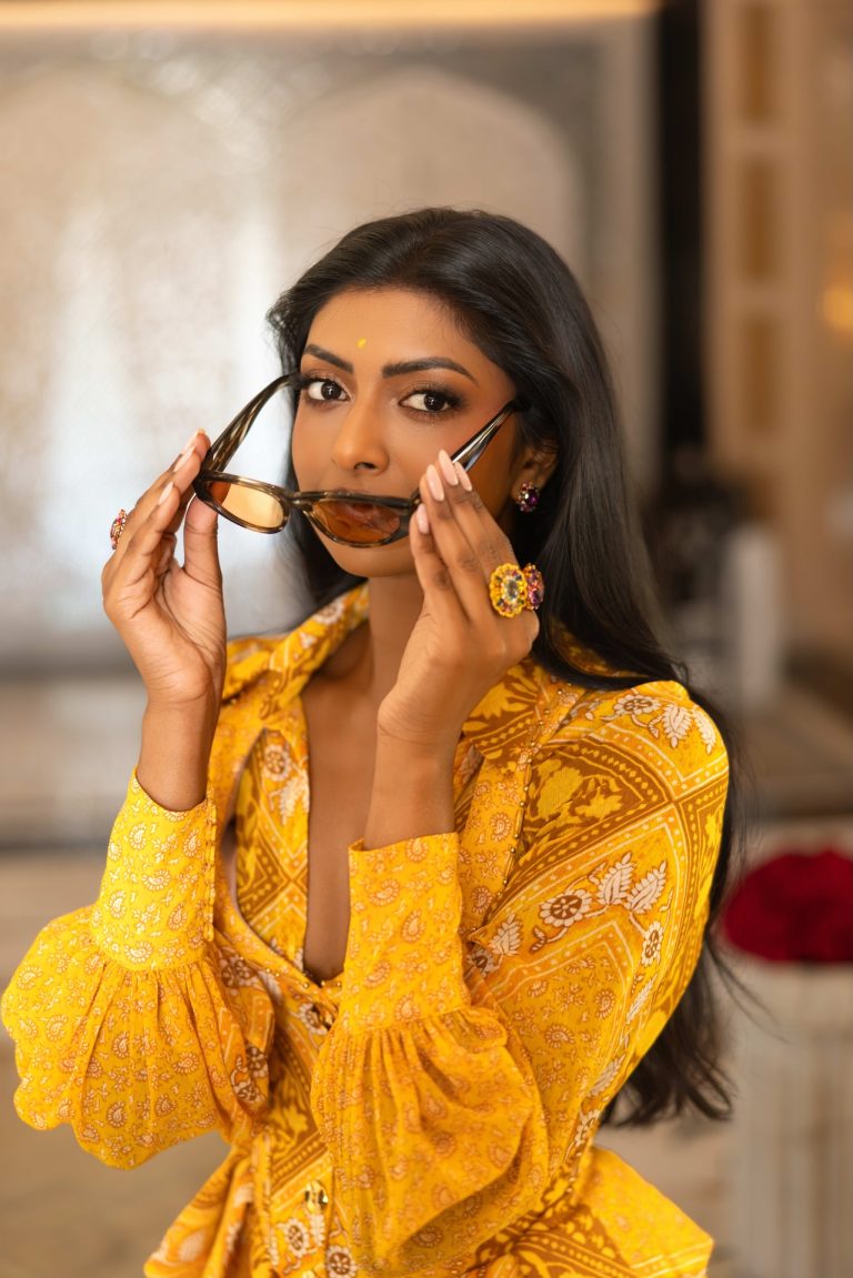 Model in yellow with sunglasses on location in Jaipur, India, photographed by Indirect Media