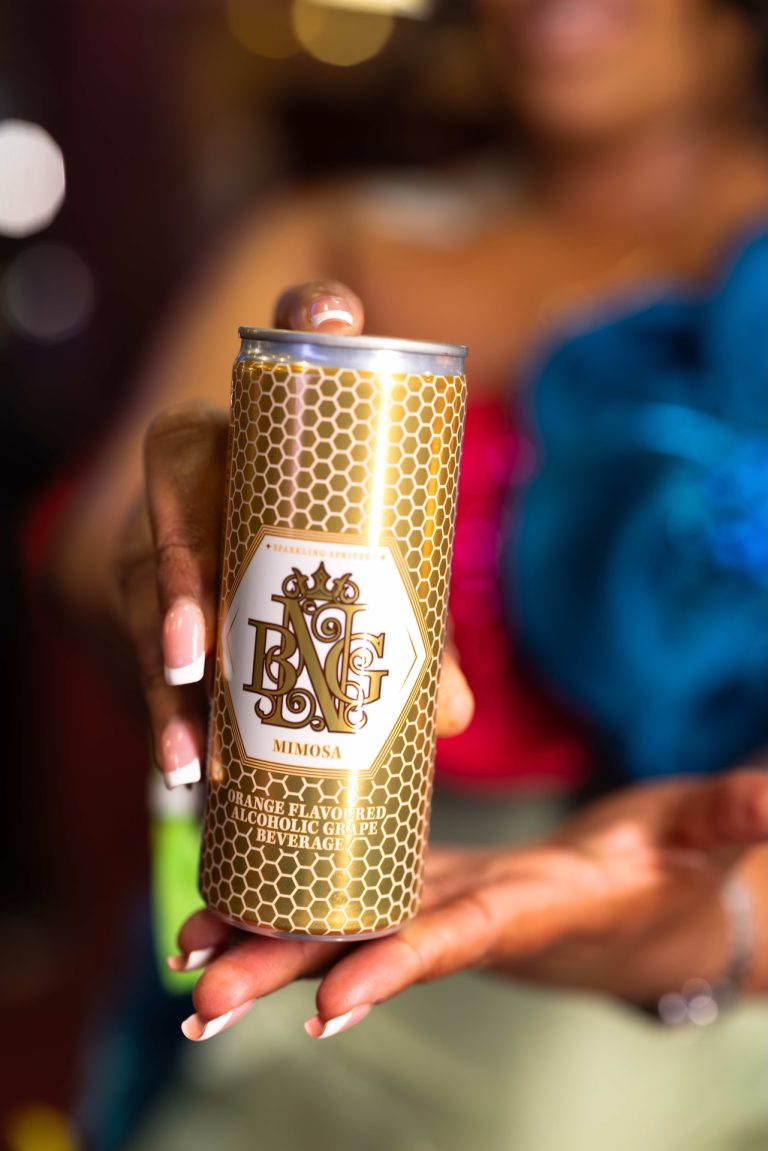 Hand holding a BNG Mimosa can at the BNG Awards, a mobile-first product frame