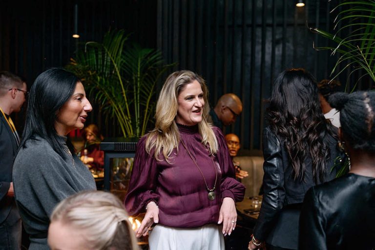 Guests in conversation at the Lifestyle Ceramics event at Decorex, July 2026, photographed by Indirect Media