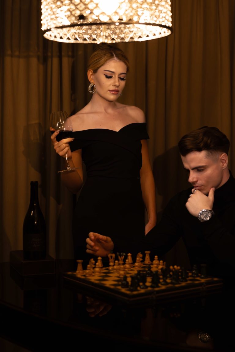Couple with Inselberg wine over a game of chess, photographed by Indirect Media