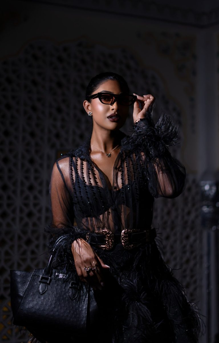 Fashion portrait with sunglasses and feathers, photographed by Indirect Media